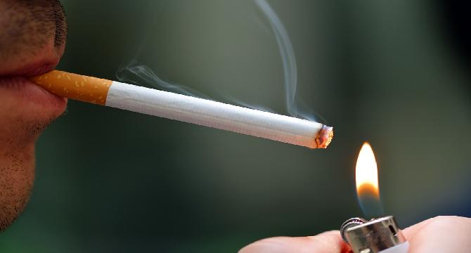 A person seated there and he lit his cigarette